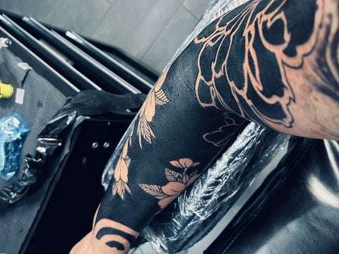 Negative Space Blackout Tattoo