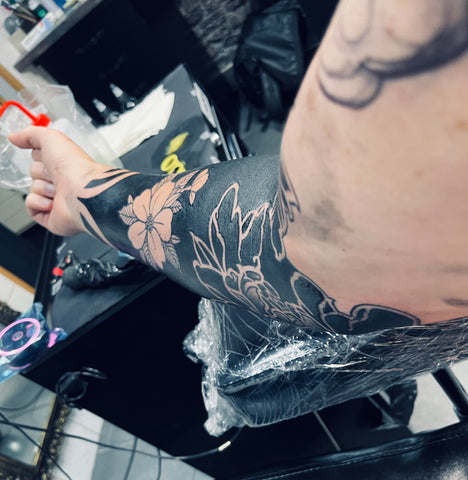 negative space blackout tattoo in progress and sore
