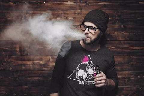 man wearing Vagabond shirt vaping