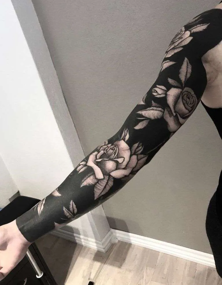 Black Sleeve Roses by Jakob Holst Rasmussen, co-owner and tattooist at Venlig Hilsen in Aarhus, Denmark.