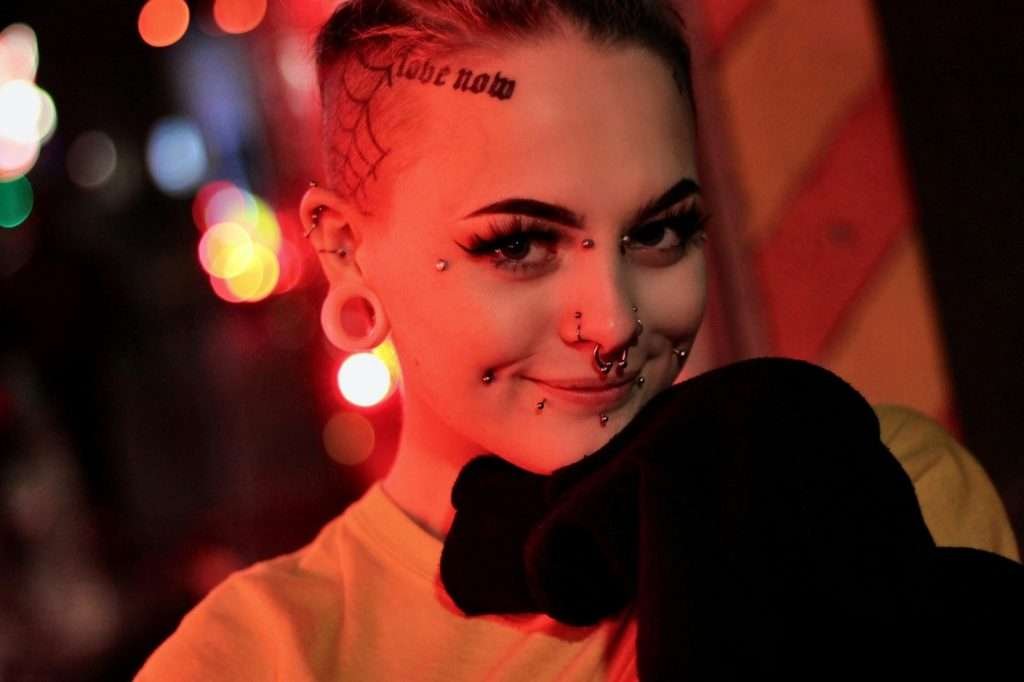 stretching ears and facial piercings