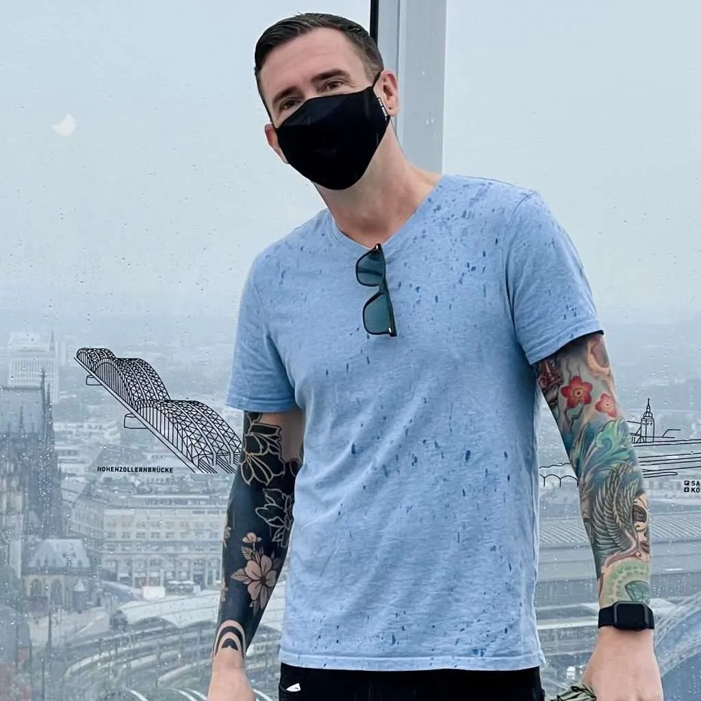 Kieran showing his tattoo sleeves